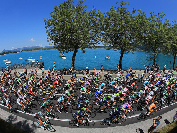 road cycling at beautiful lake annecy in the french alps