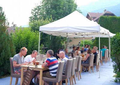 Guests having dinner in garden