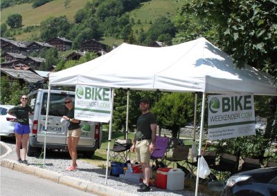 Team offering drinks to cyclists