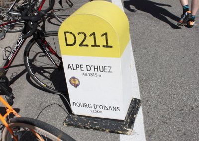 Road marker for the summit of Alpe d'Huez mountain climb